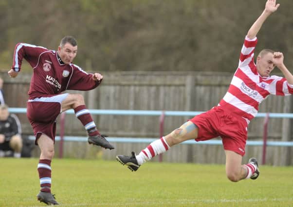 SHOT: Cumbernauld United's David Dickson fires in a shot at goal with Lesmahagow's Daryl Meikle trying to block.