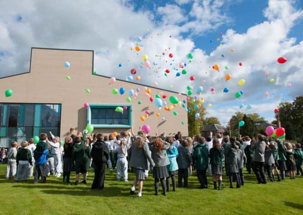 Up, up and away...pupils, staff and parents showed their appreciation for their new school by releasing balloons at Kirkton Primary (Pics by Sarah Peters)