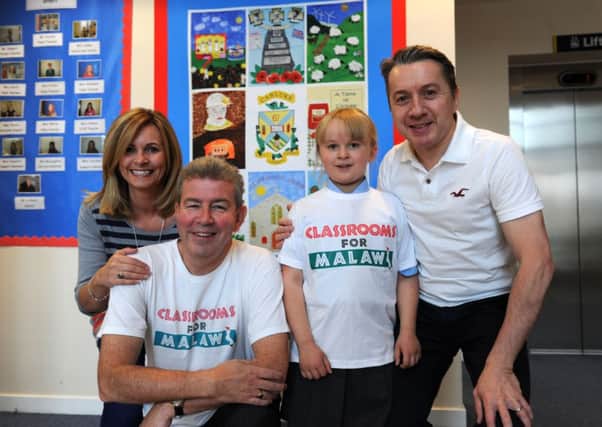 Fundraiser...Holly with her parents and John Duffy of Classrooms for Malawi