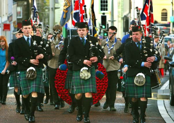 In tune...Lanark and District Pipe Band led Sunday's Remembrance Service parade. (Pic by James Clare)