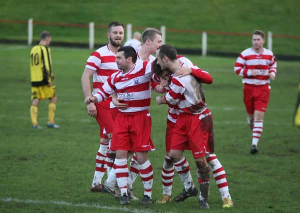 Great goal...Jack Taylor is mobbed by Lesmahagow team-mates (Pic by Johnny Weir)