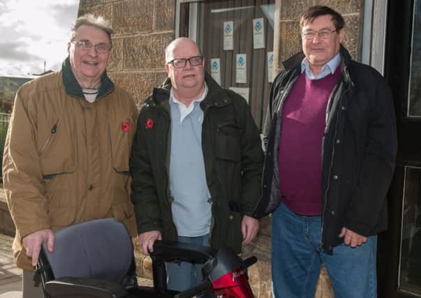 Under threat...Volunteers Ray Green, Sandy McDonald and John Davis at Carluke's Disability Resource Centre. (Pic by Sarah Peters)