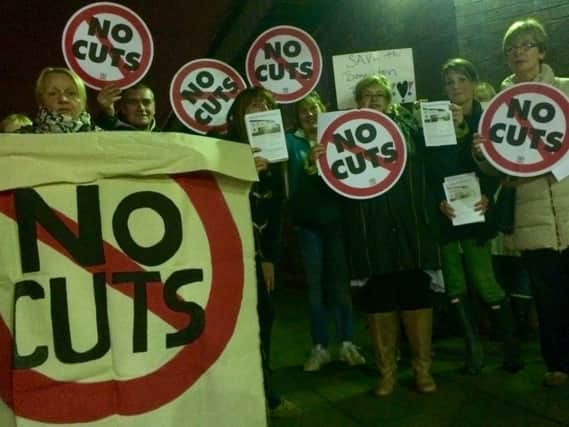 Campaigners protest the plans at a recent closed meeting on the budget