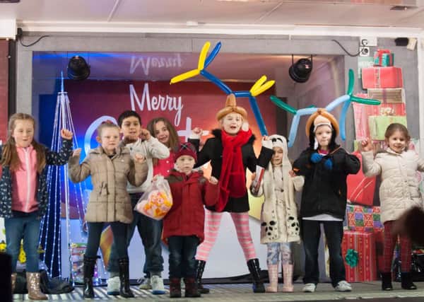 Centre stage...wee ones get in on the fun at Carluke Christmas Lights Switch On in the town on Friday, November 28, 2014 (Pics Sarah Peters)