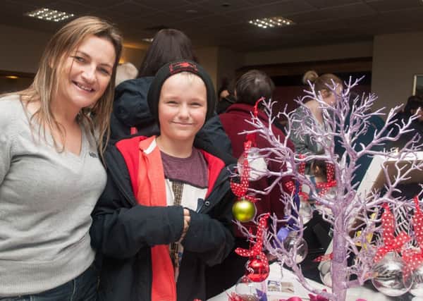 Christmas fair...attracted a host of stalls and visitors. The event was organised by Vicky and David Rogers, whose daughter Nell was stillborn, to raise funds for the charity in her name, Nell's Footprints. (Pic Sarah Peters)