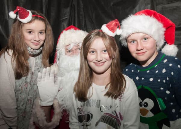 A wave from Santa...and his young friends, prior to the Christmas Lights Switch On in Forth on Saturday, November 23, 2014 (Pics Sarah Peters)