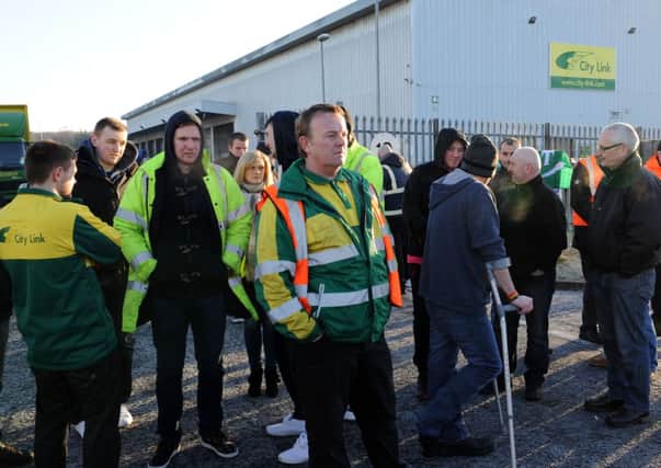 Workers at City Link hear the news the firm is to fold