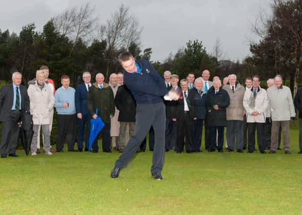 Big hit...Mark Darroch launches the 2015 season at Lanark Golf Club, watched by his fellow members
