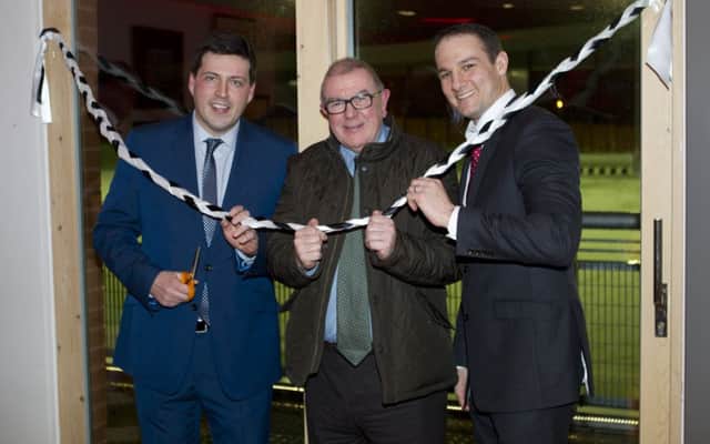 Sports minister Jamie Hepburn, left, cuts the tape at the opening ceremony.                 Picture by Ian Cairns