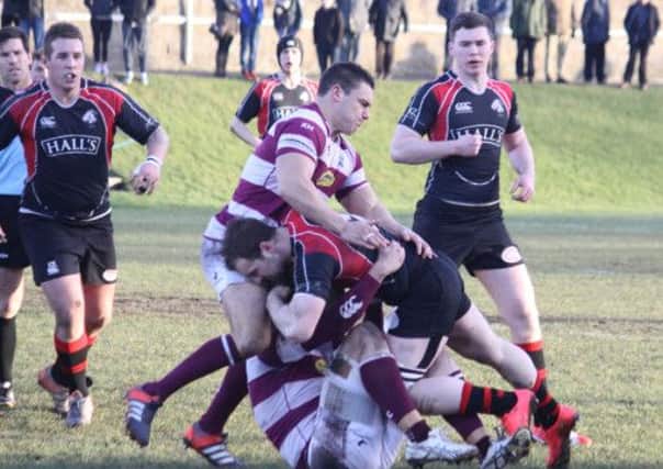 Crowded out...Craig Buchureweski gets halted by the Watsonians defence
