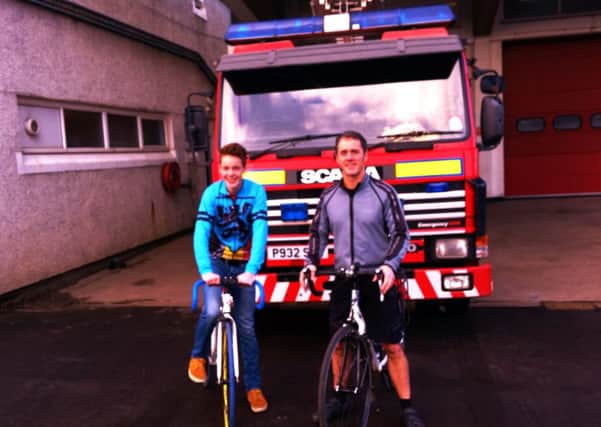 Antony (17) and dad Grant gather support at Clarkston Fire Station, where Grant works as watch manager
