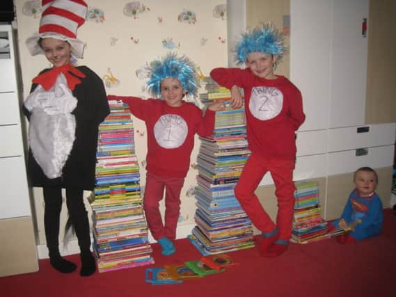 From left: sister Sophia (9), brother Franco (7), Tony (4) and little Leo at just eight months with a tower of books as tall as themselves