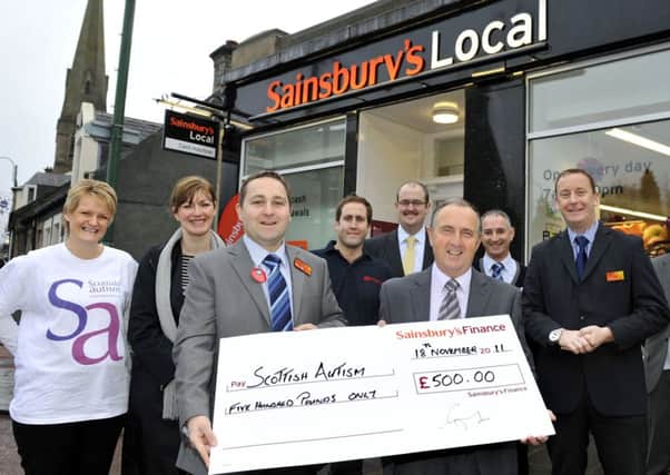 Cheque please...staff at Sainsbury's hope to write another cheque after charity fun day