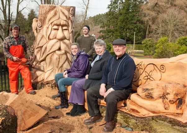 Happier day...as well as the carvings, the work included three table tops for the fairy dell in Castlebank but two of them have been stolen today  (Picture by Sarah Peters)