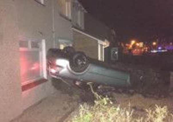 DRAMA: The car landed on its roof