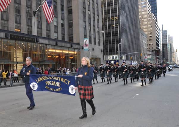 Marching on...Lanark and District Pipe Band lead Tartan Day Parade in New York (Pic by Ron Gower

)