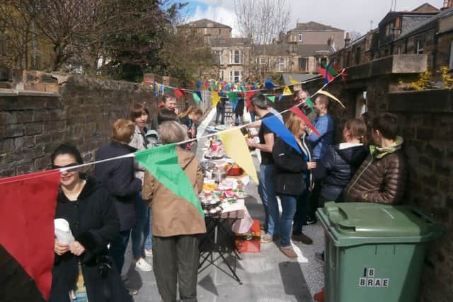 Above: lane party and below: before the clean up. Bottom: Councillor Graham cuts the ribbon
