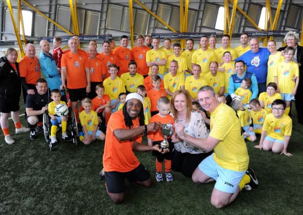 Team captains Jose Quitongo and Tom Boyd with Claire Harden and mascot Evan
