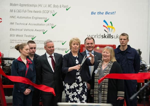 Grand opening... Roseanna Cunningham opens HGV training at New College Lanarkshire's Motherwell Campus flanked by students including Fraser Boyd (16) from Auchengray and Gabriella Jagger (19) from Carluke.