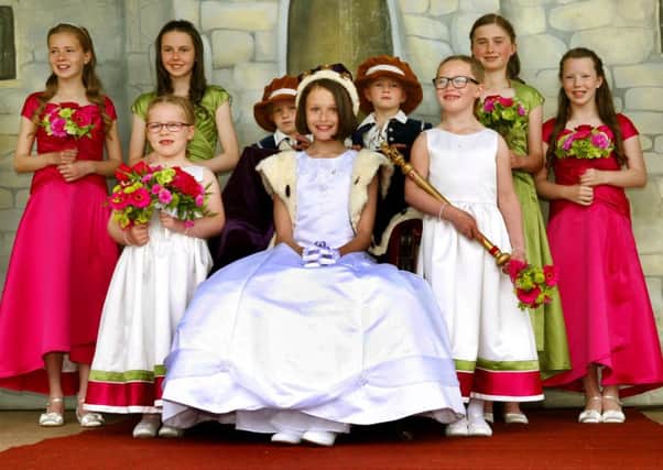 In the spotlight...Fleming Queen Katie Child and her regal retinue look every inch like royalty at the 2015 Biggar Gala Day (Pic James Clare)