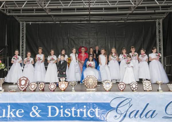 Cast of characters...surround the 2015 Carluke Gala Queen Caoimhe Rea for the crowning ceremony in Market Square (Pic Sarah Peters)