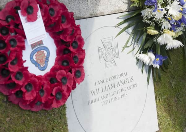 100 years on...but Carluke has not forgotten the heroic actions of one of its three VCs, laying a stone to commemorate William Angus in Market Square on Friday, June 12, 2015 (Pic Sarah Peters)