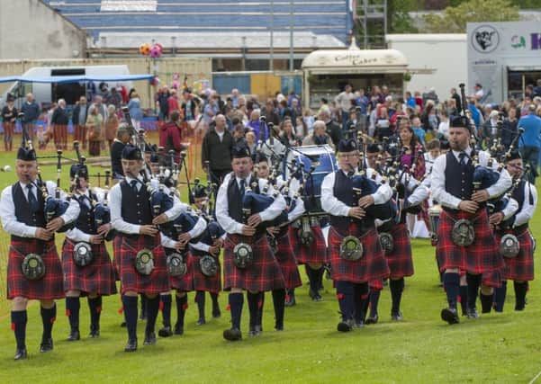 Leading the way...pipe band leads locals to the action in the Glebe Park for the 54th Lesmahagow Highland Games (Pic Sarah Peters)
