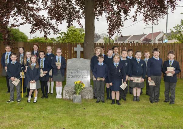 Paying tribute...St John's Primary pupils