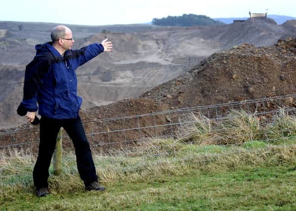 Campaigner Mark Stephens and the existing quarry
