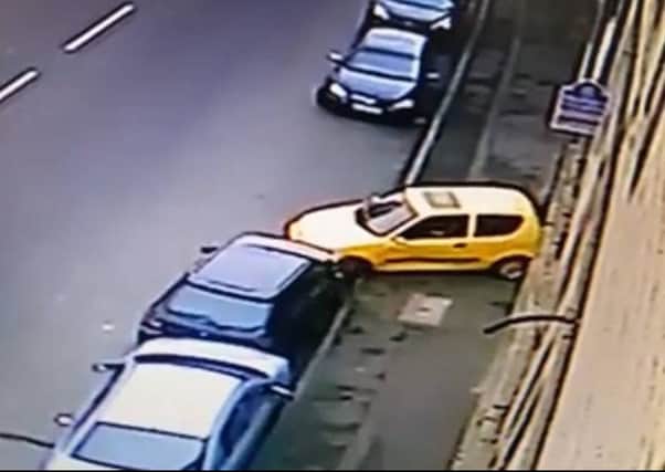A driver in Corbiehall, Bo'ness is caught on CCTV crashing into a car while trying to park.