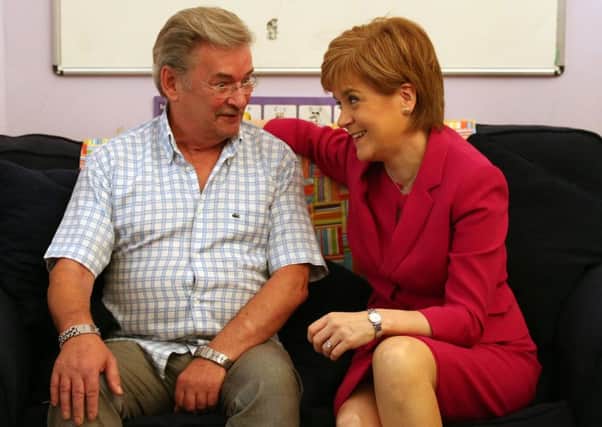 First Minister Nicola Sturgeon with Michael Brown, whose daughter Clare was murdered by her ex-boyfriend in 2009. Picture: PA