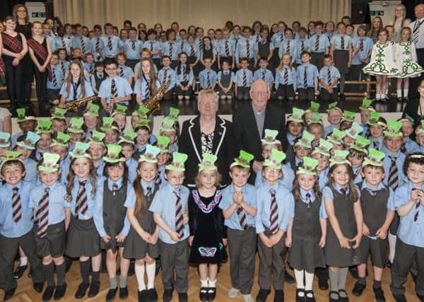Celebrating...Father Naughton with Mary Maguire and the whole school. (Pic Sarah Peters)