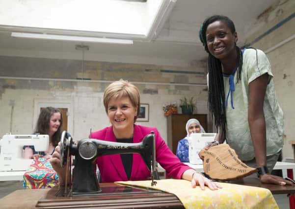 15/07/15...
GOVANHILL - GLASGOW.
First minister Nicola Sturgeon at Scottish Government's Greener Together Award winner
Govanhill Baths Community Trust with Rags To Riches Project manager Nadine Gorency