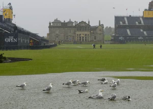Flooding on the first fairway as heavy rain flooded the Old Course and play was suspended. Picture Ian Rutherford