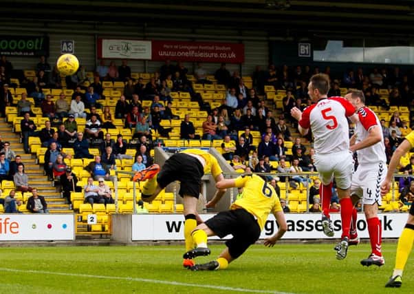 Michael Bolochoweckyj heads home Clydes goal at Livingston.