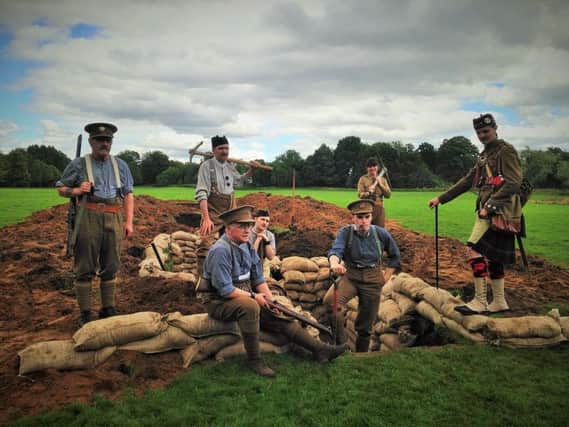 Above: WWI re-enactors use the first Digging In trench to recreate a Glasgow University archive photo (below). Bottom: lord provost Sadie Docherty braves the trench