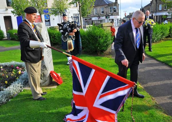Tribute...Carluke's Bill Brown turns away after laying the Lanarkshire Yeomanry wreath. His 'big' brother, George, died aged 23 of starvation and dysentery as a Japanese POW