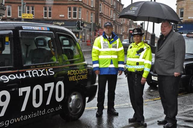 Chief inspector Carol McGuire and Stephen Flynn, vice chair of Glasgow Taxis, with a new Shawlands marshal