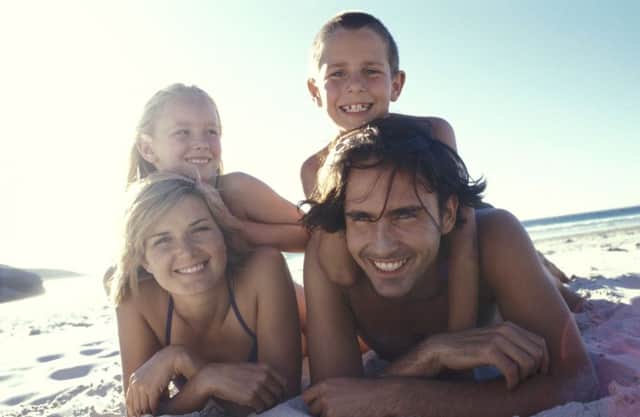 A family on holiday together on the beach. See PA Feature FINANCE Post Holiday. Picture credit should read: PA Photo/thinkstockphotos. WARNING: This picture must only be used to accompany PA Feature FINANCE Post Holiday.