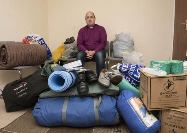 Newly-launched appeal... Bryan Kerr from Greyfriars Church with donations for the refugees ( Picture Sarah Peters).