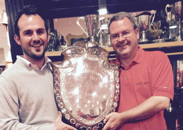 Windyhills Kevin Smyth receives the Kirkintilloch Shield trophy