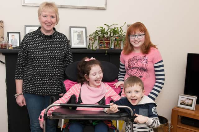 20-03-2015 Picture Sarah Peters.   Alison Turley with daughter Clare who has Cerebral Palsey and daughter racel and son Thomas.