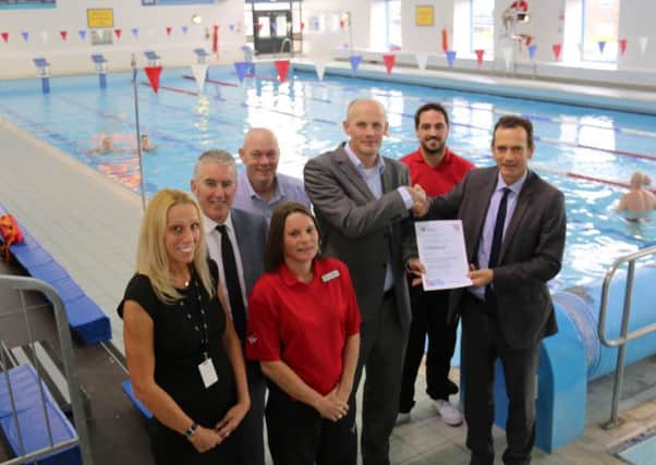Representatives of NL Leisure receive the SwiMark award from Scottish Swimming