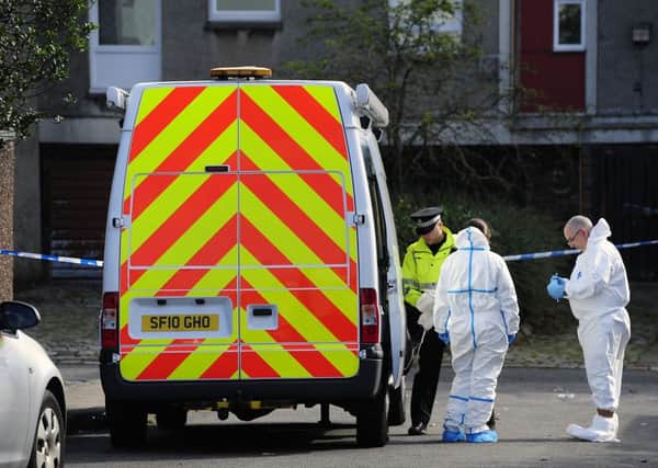 A forensics team in Glenhove Road earlier today.