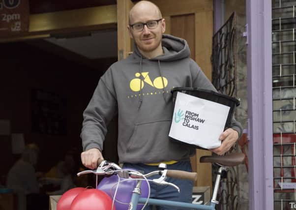 Corner Bikes Stephen Steele gets on his bike in aid of refugees