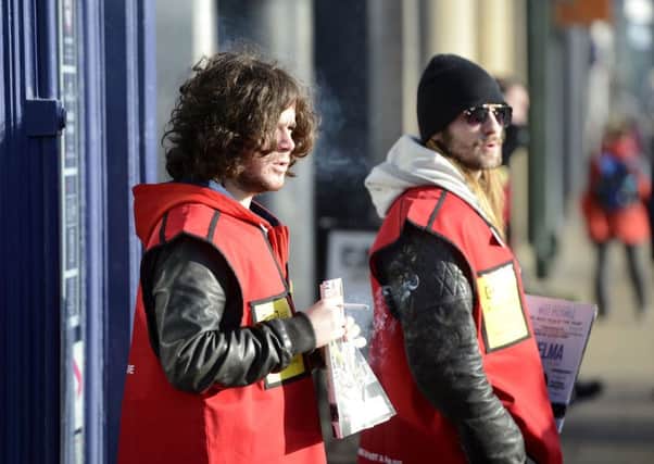 The View bandmembers  Kyle Falconer and Steven Morrison selling The Big Issue to  raise the profile of homelessness