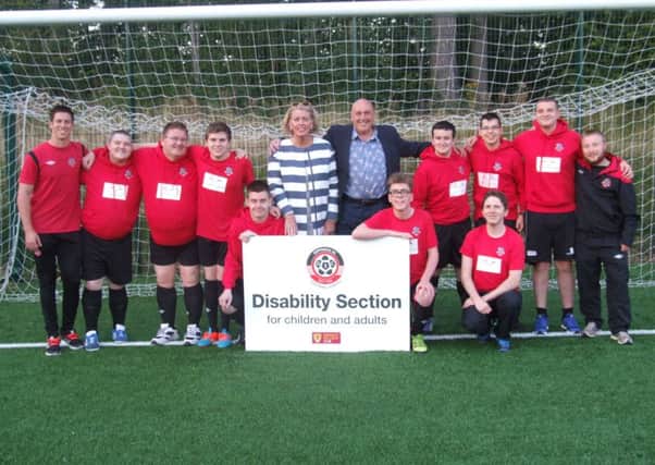 Giffnock United with their Community Care Choice kit