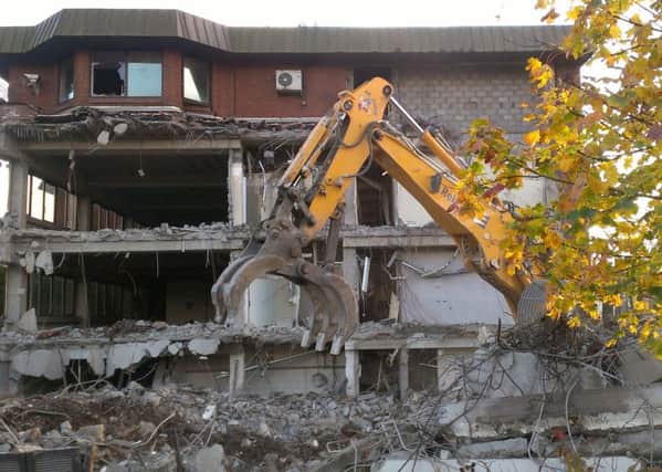 The former Tom Johnston House council headquarters are being knocked down