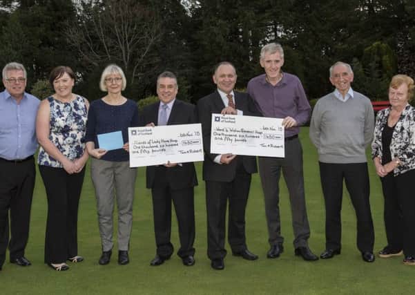 Tom Kirkland prsenting Cheques for £1650 each to Lady Home Hosiptal and Ward 4 of Wishaw General