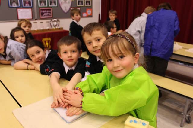 Netherlee youngsters Charlie Annand, Thomas Motler and Olivia Prentice make their mark for Marys Meals